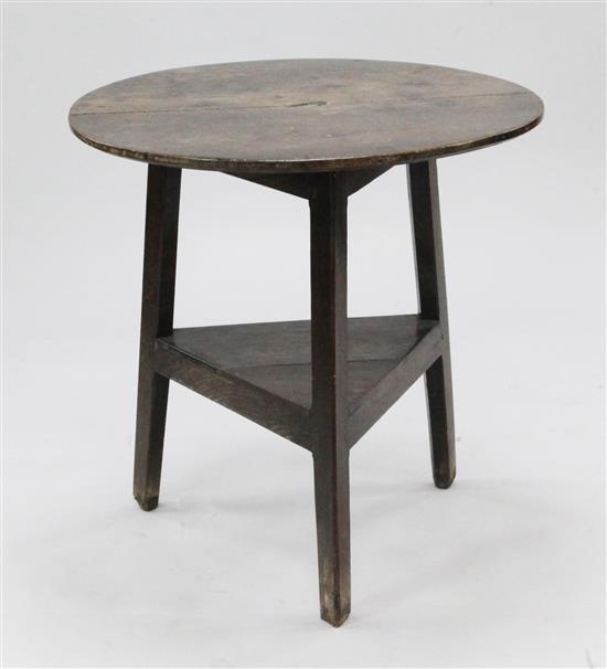 A George III oak circular cricket table, H.2ft 4in. Diam. 2ft 3.5in.